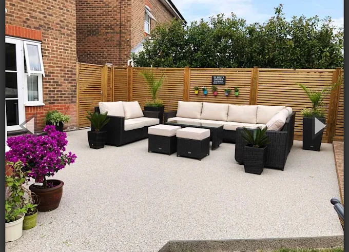 Resin bound patio and seating area landscaped by JM Driveways & Paving Ltd